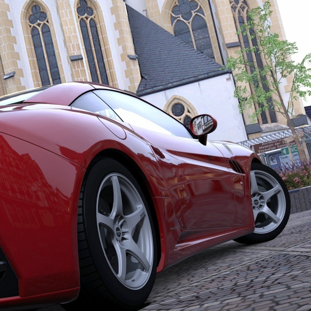 Red sports car in the square at the Cathedral
