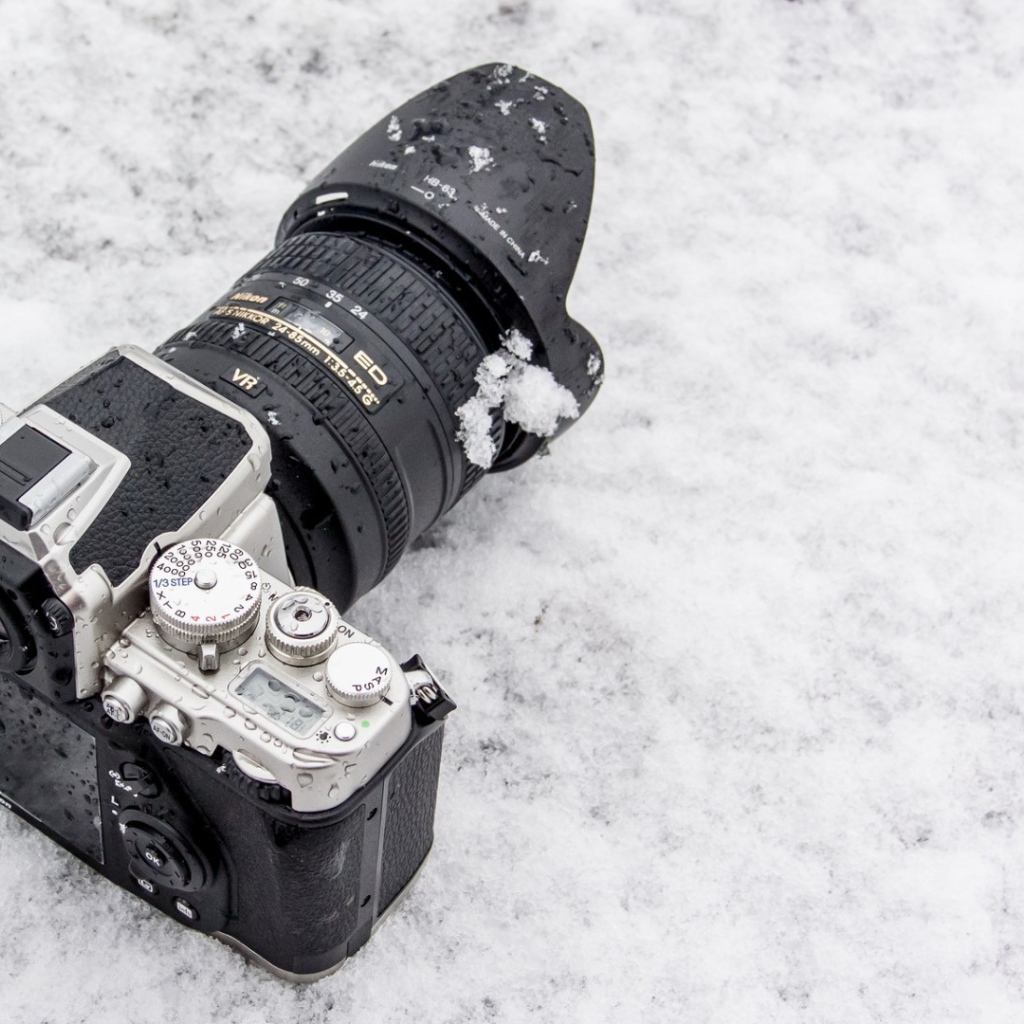 The camera lies in the snow