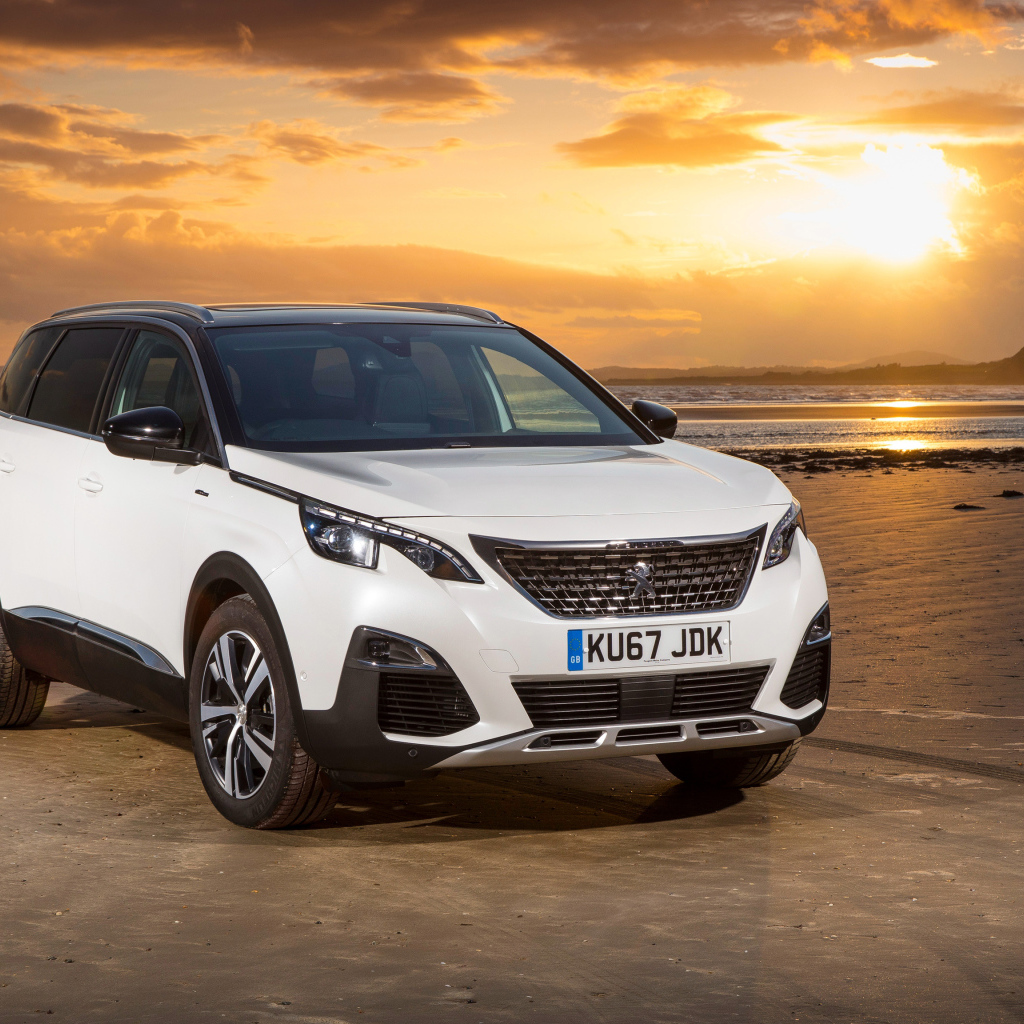 White SUV Peugeot 5008 GT Line, 2017 on a sunset background