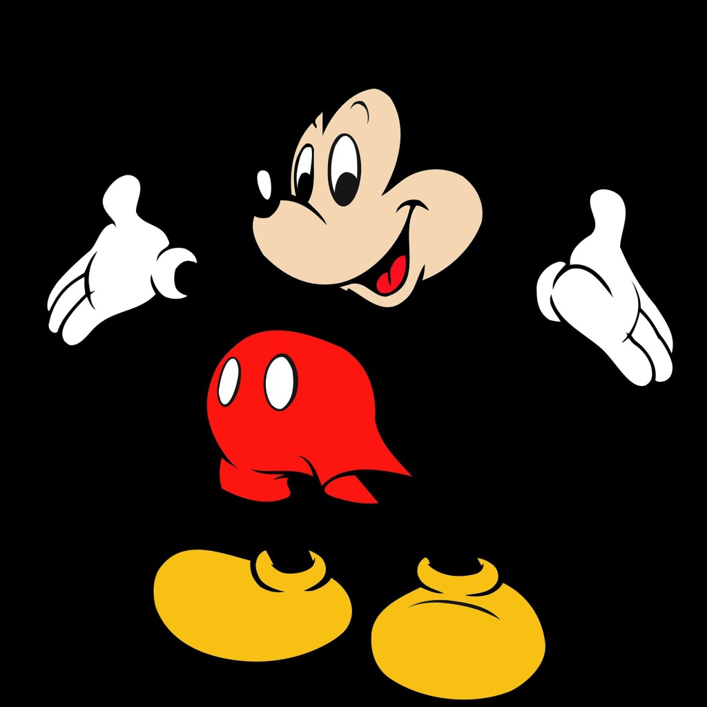 Популярный герой мультфильмов Микки Маус на черном фоне