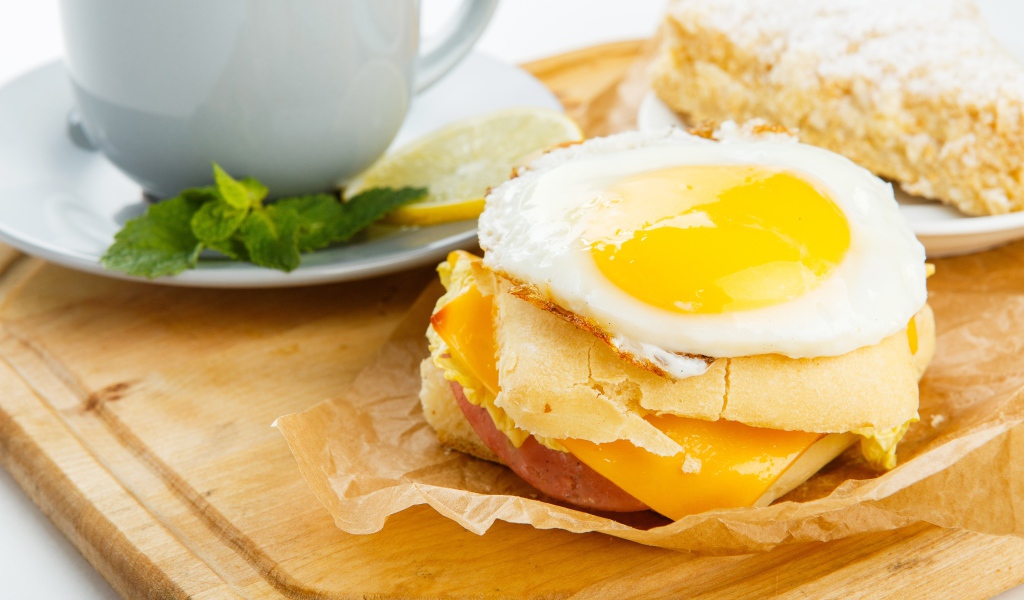 Sandwich with scrambled eggs for breakfast
