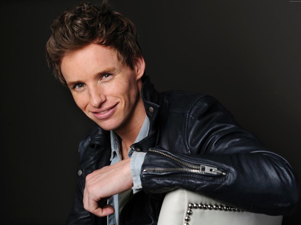 Young actor Eddie Redmayne in a black leather jacket