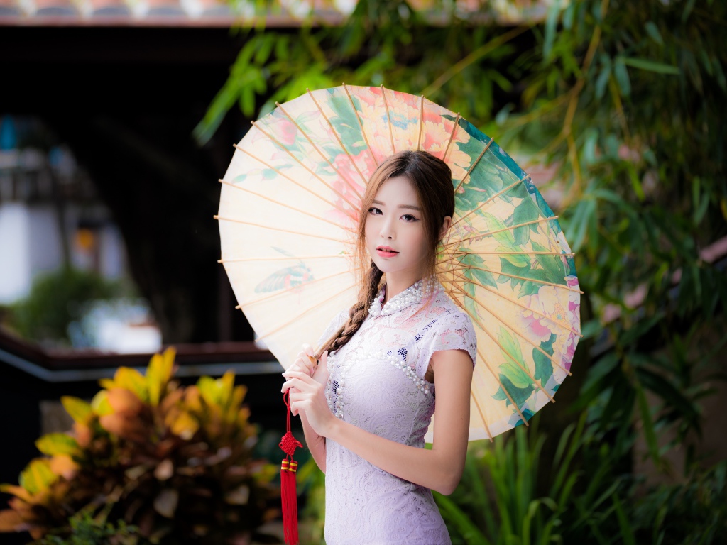 Beautiful asian girl in white dress with umbrella