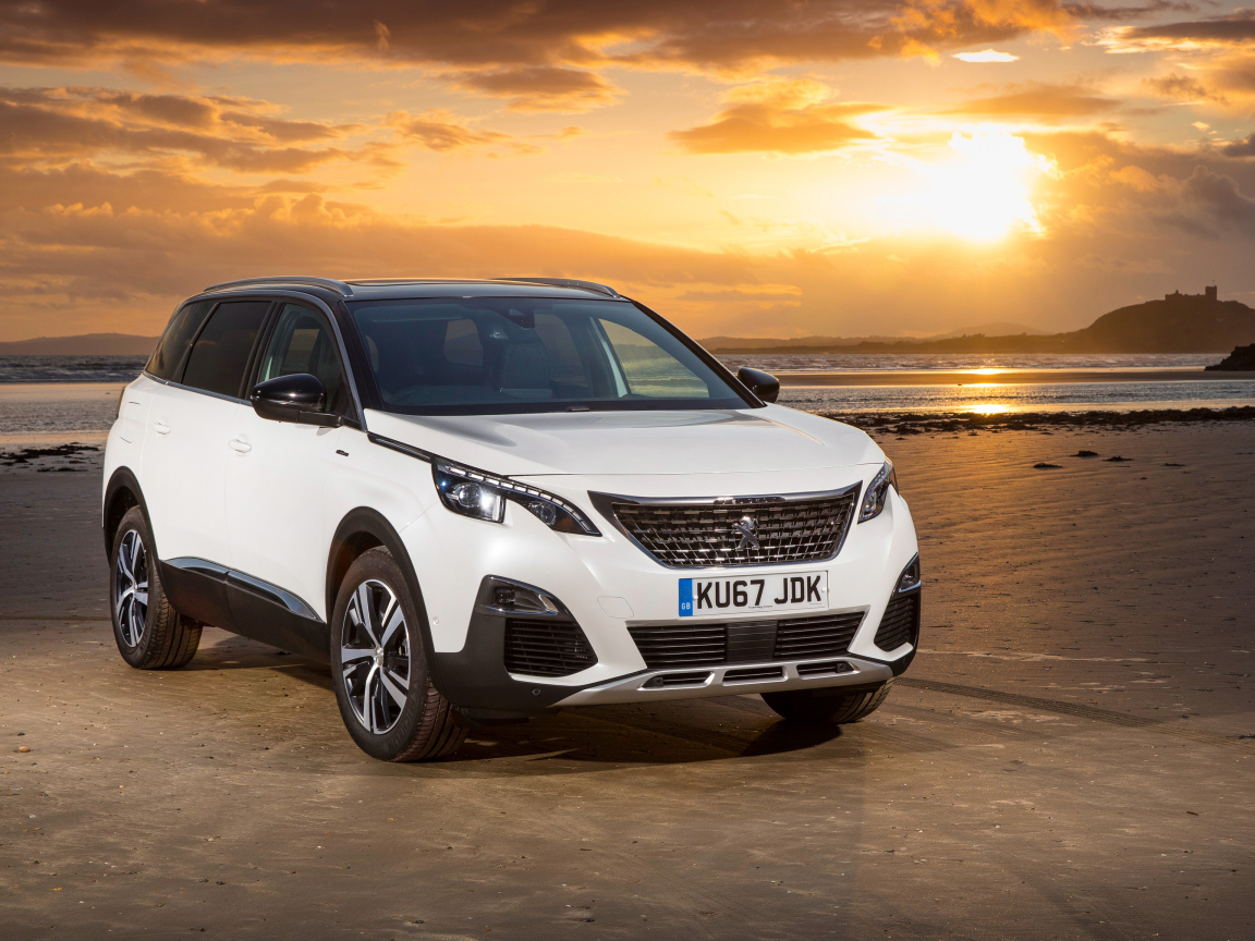 White SUV Peugeot 5008 GT Line, 2017 on a sunset background