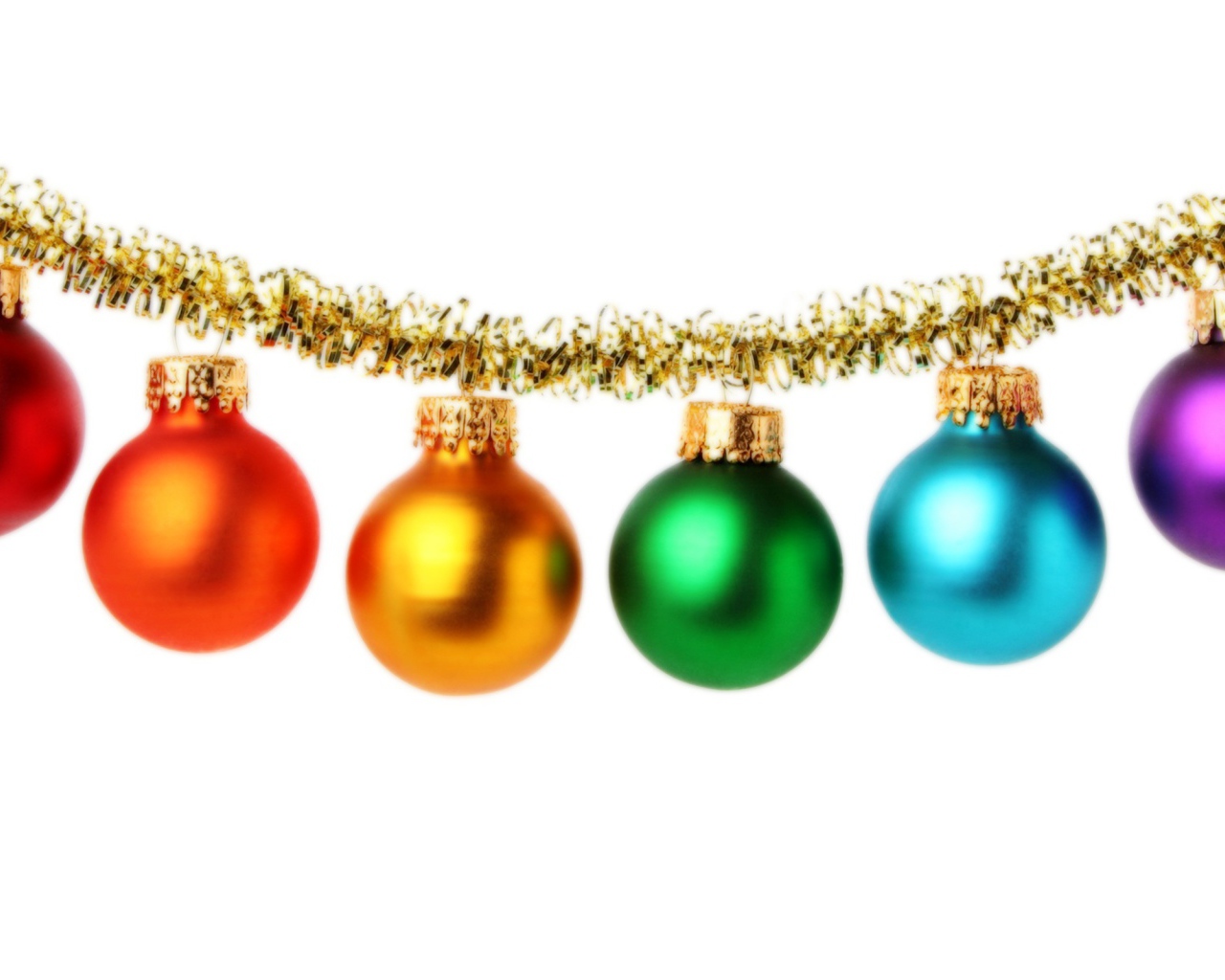 Multi-colored Christmas tree toys on a white background