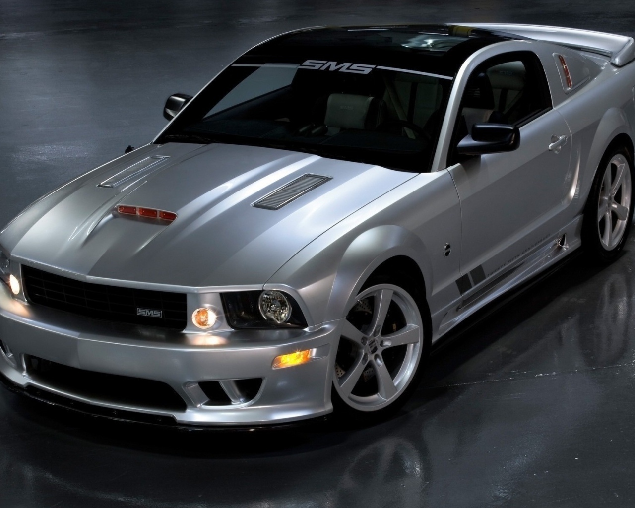Silver Mustang on the concrete floor