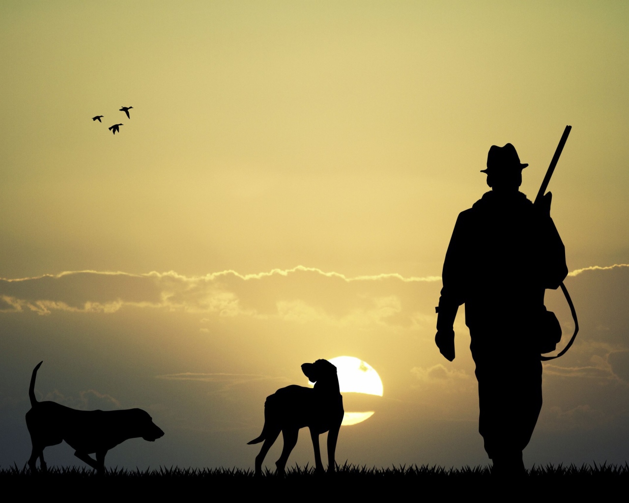 Охотник с собаками на фоне солнца