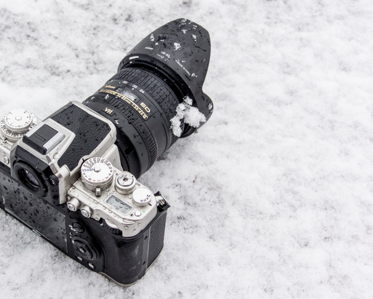 The camera lies in the snow