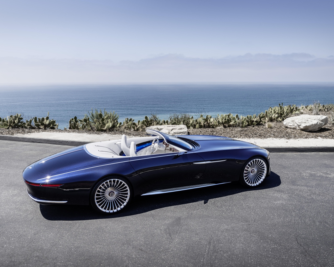 Blue car cabriolet Mercedes-Maybach 6 on the background of the ocean