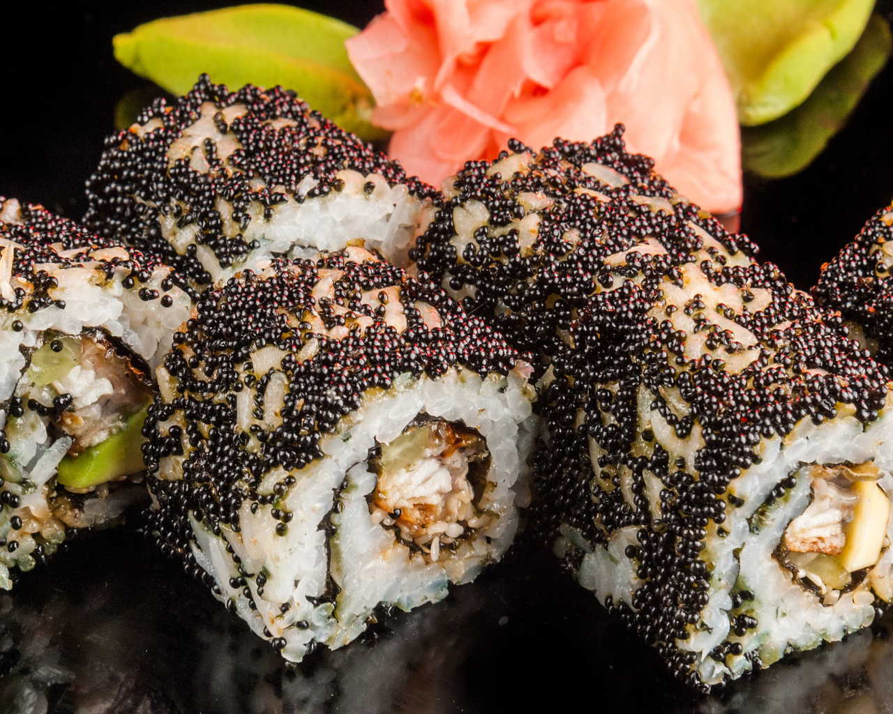Appetizing rolls with black caviar