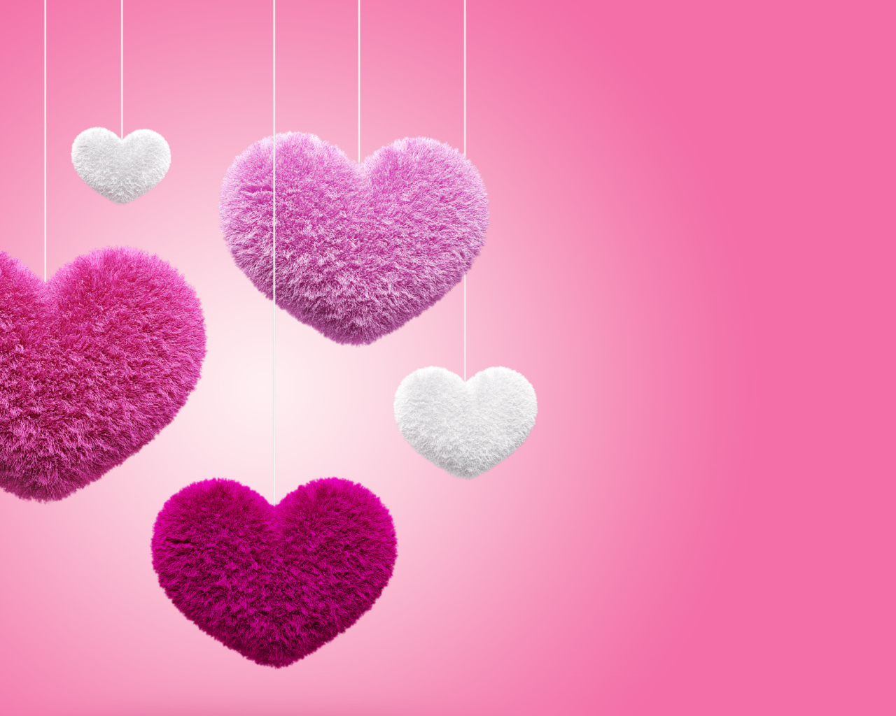 Soft fluffy hearts on a pink background