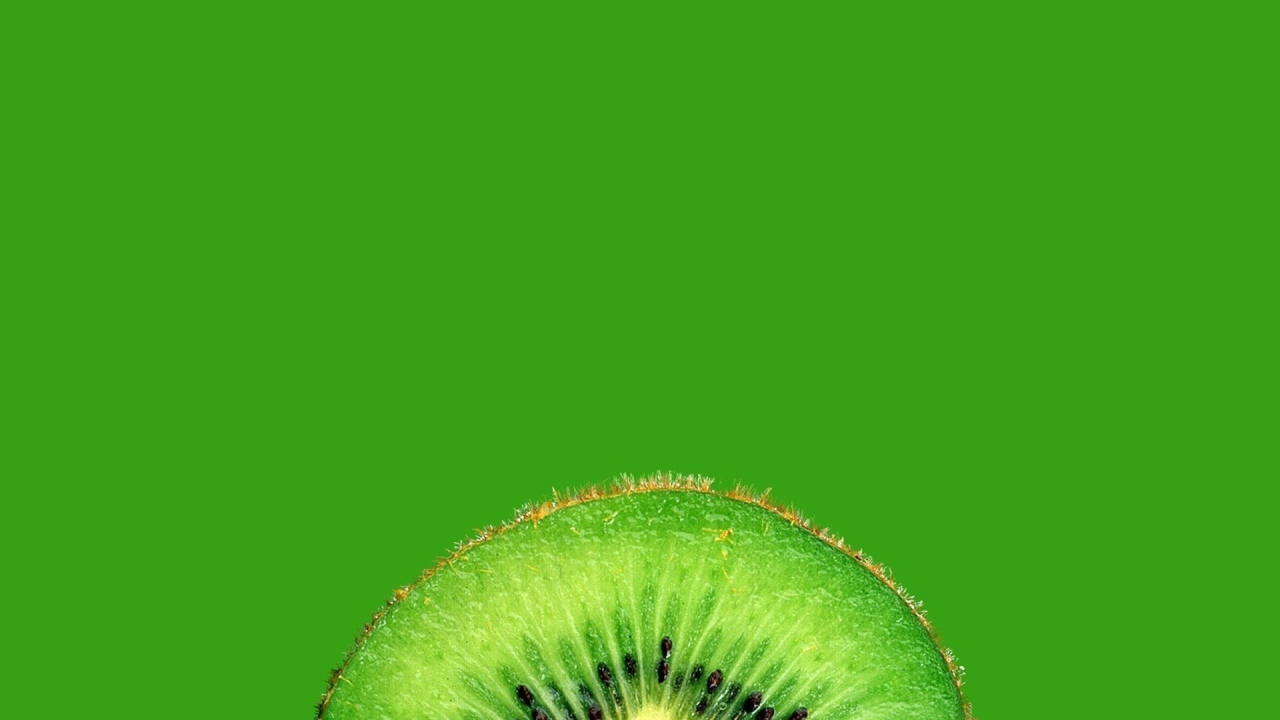 Ломтик киви, зеленый фон