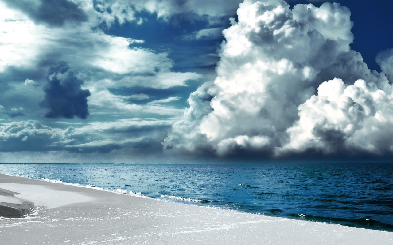 White sand, sea, overcast sky