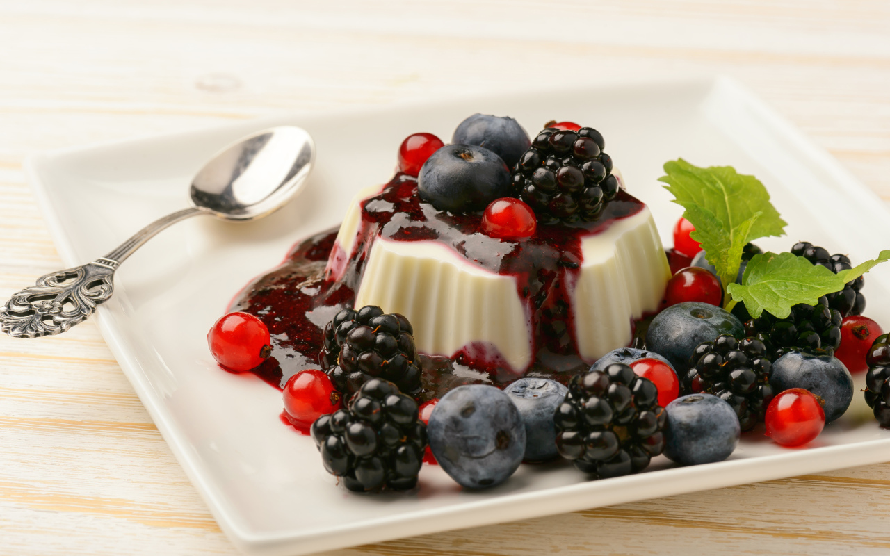Appetizing jelly with blueberries, currants and blackberries and jam