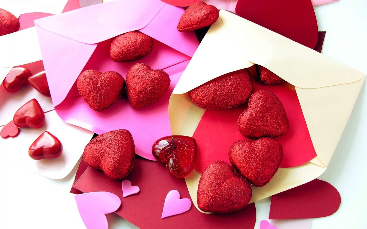 Red hearts in colored envelopes 