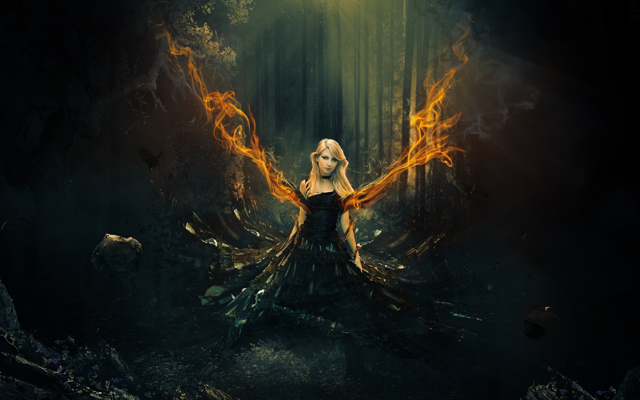 Fantastic girl in a black dress with fiery wings