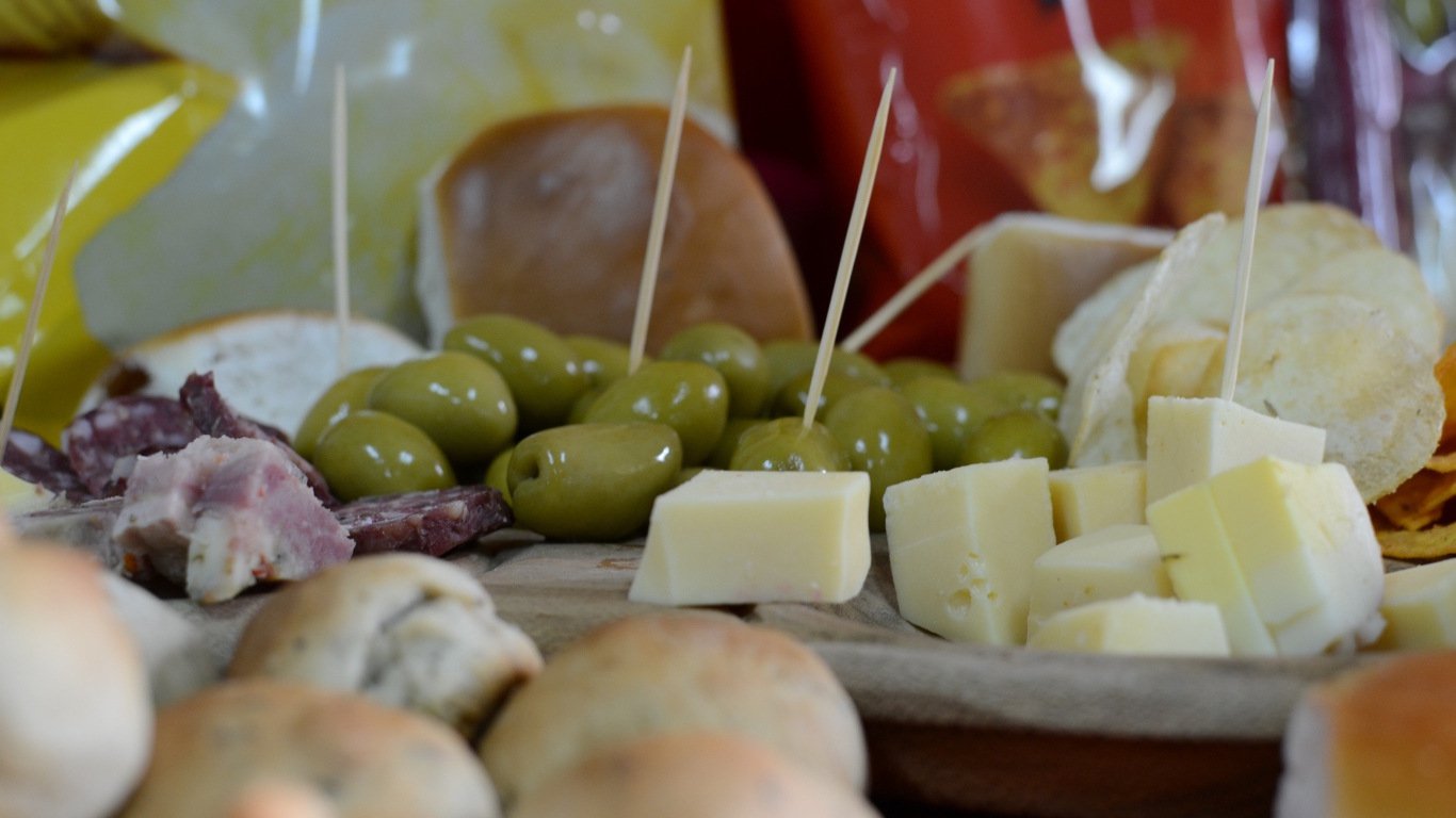 Pieces of cheese and olives as a snack