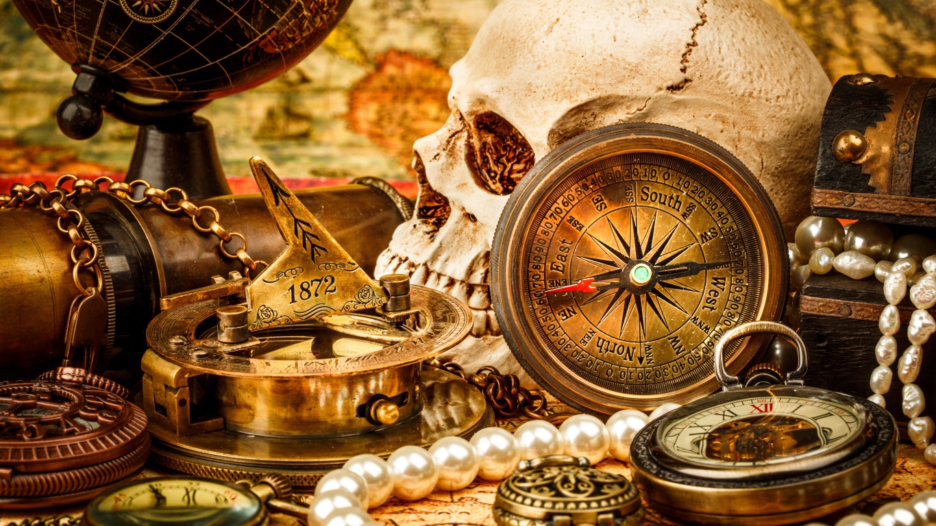 Череп, бинокль, компас, жемчуг и старинные часы на столе