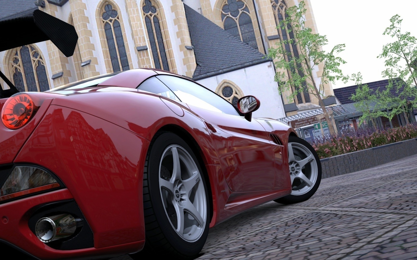 Red sports car in the square at the Cathedral