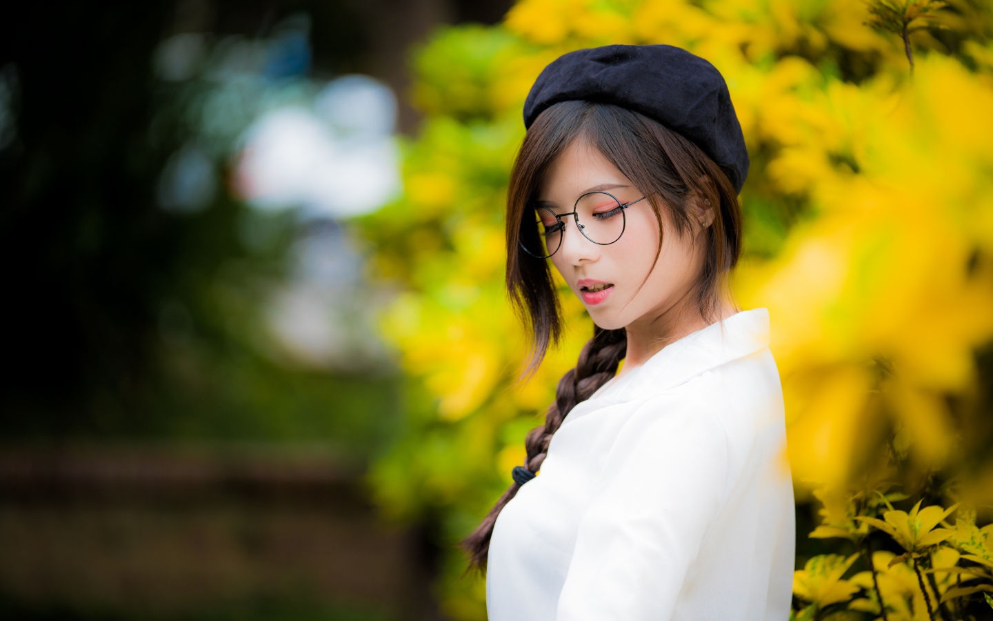 Asian girl with glasses and a black beret