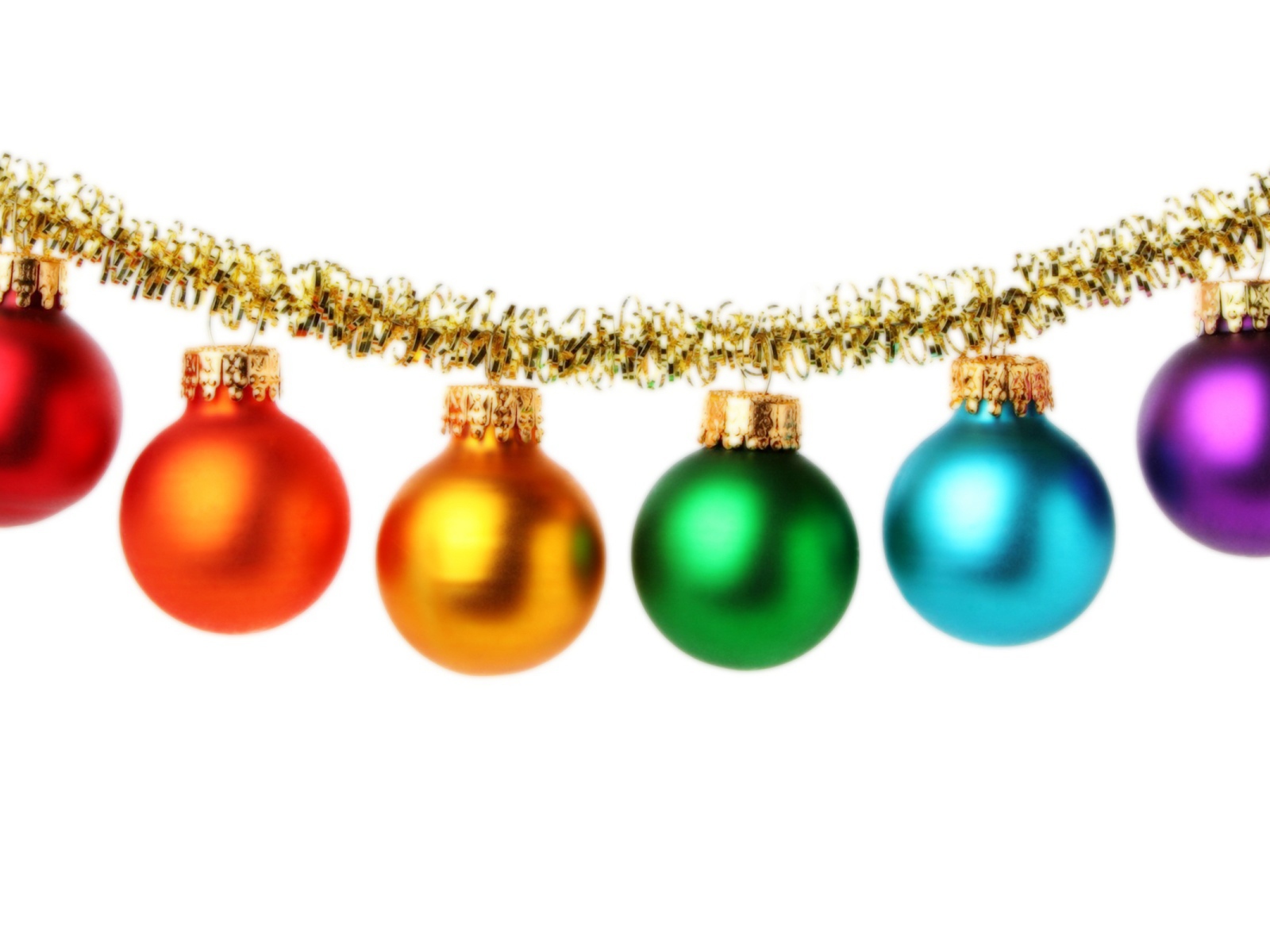 Multi-colored Christmas tree toys on a white background