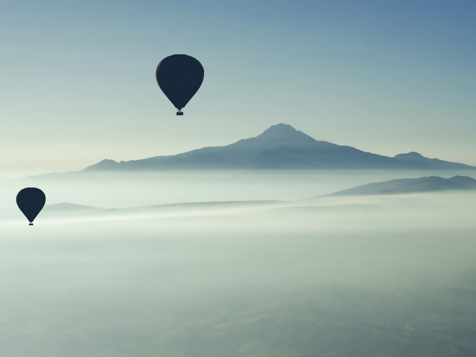 Hot air ballooning above the fog