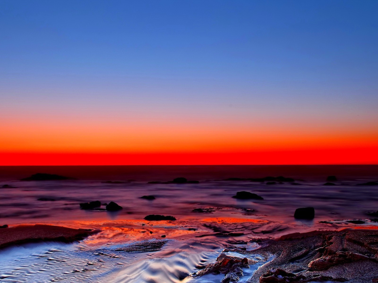 Blue sky and red sunset on the beach