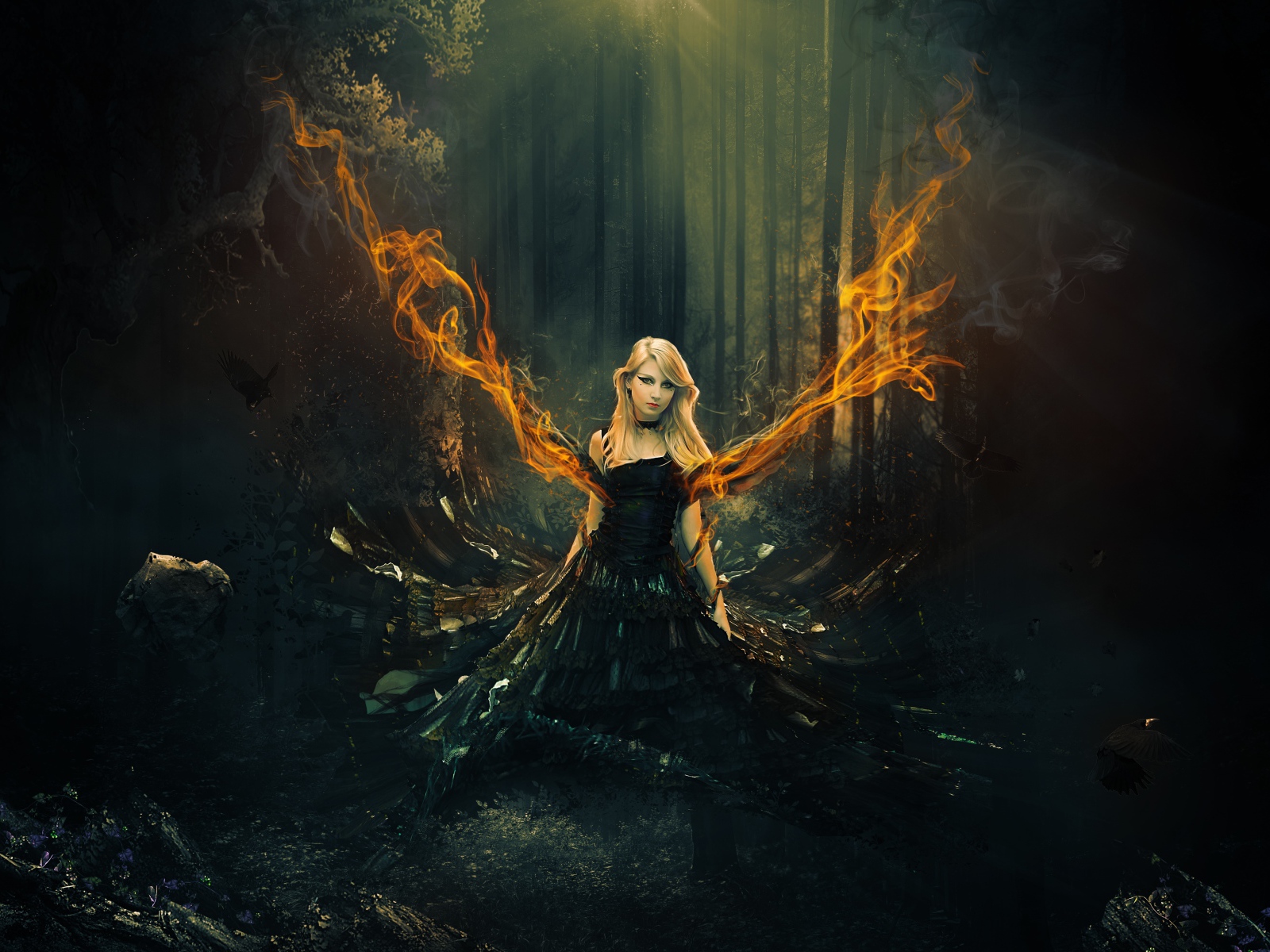 Fantastic girl in a black dress with fiery wings