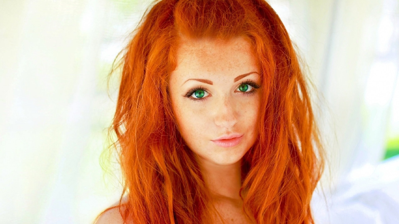 The red-haired model with green eyes