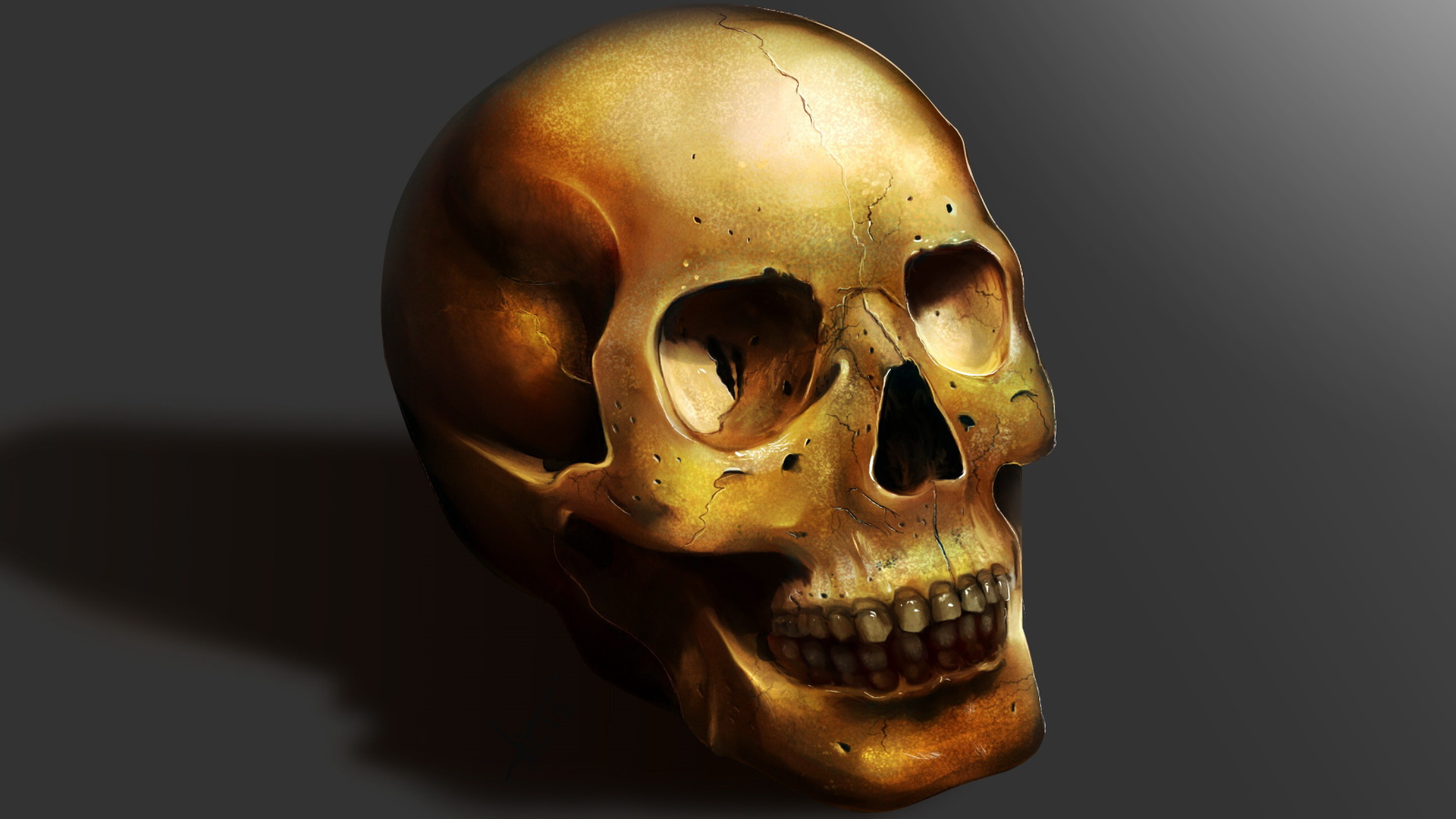 Золотой череп на сером фоне