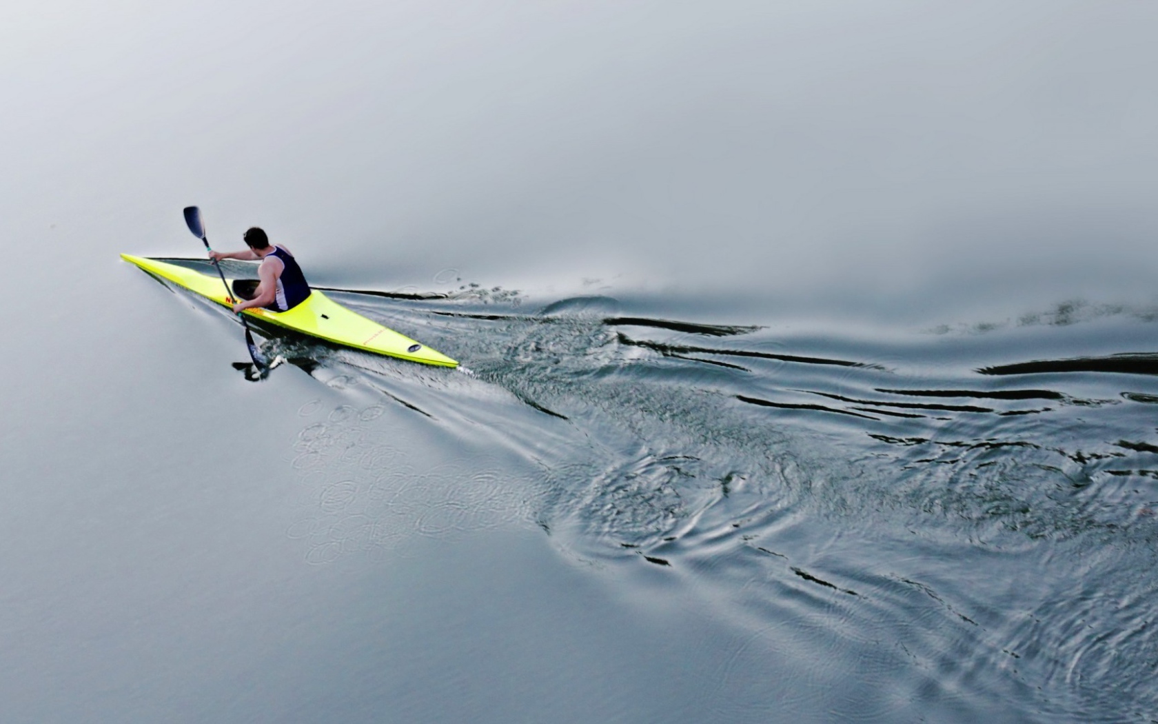Athlete on a kayak in water