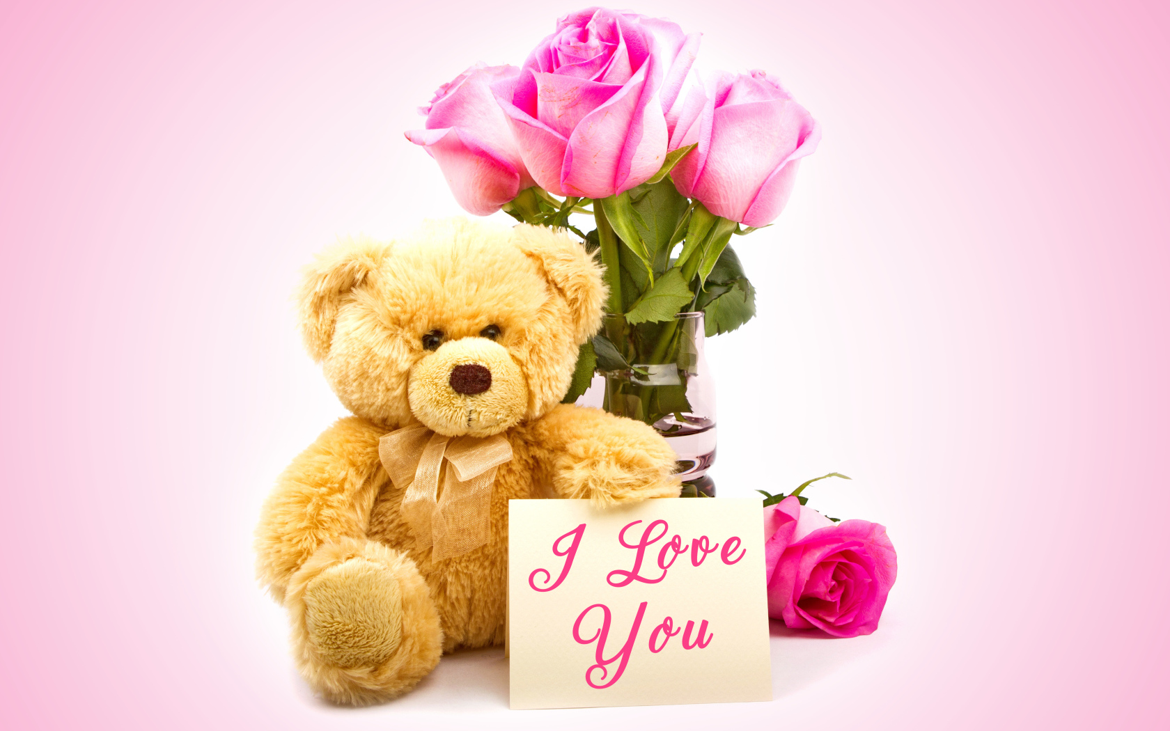 Плюшевый медведь с букетом розовых роз и надписью Я тебя люблю