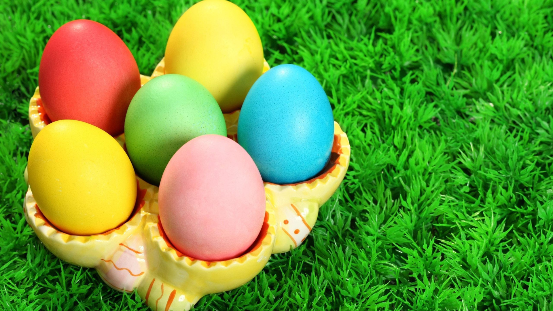 Colorful eggs on grass for Easter
