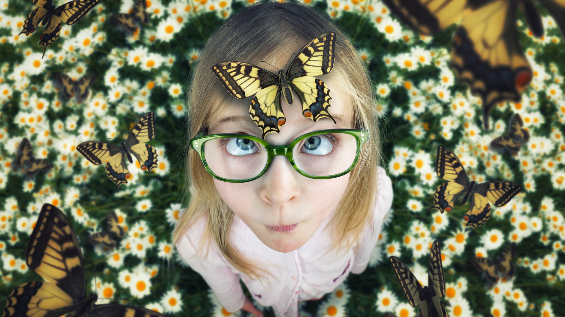 Funny girl with glasses with a butterfly on her head