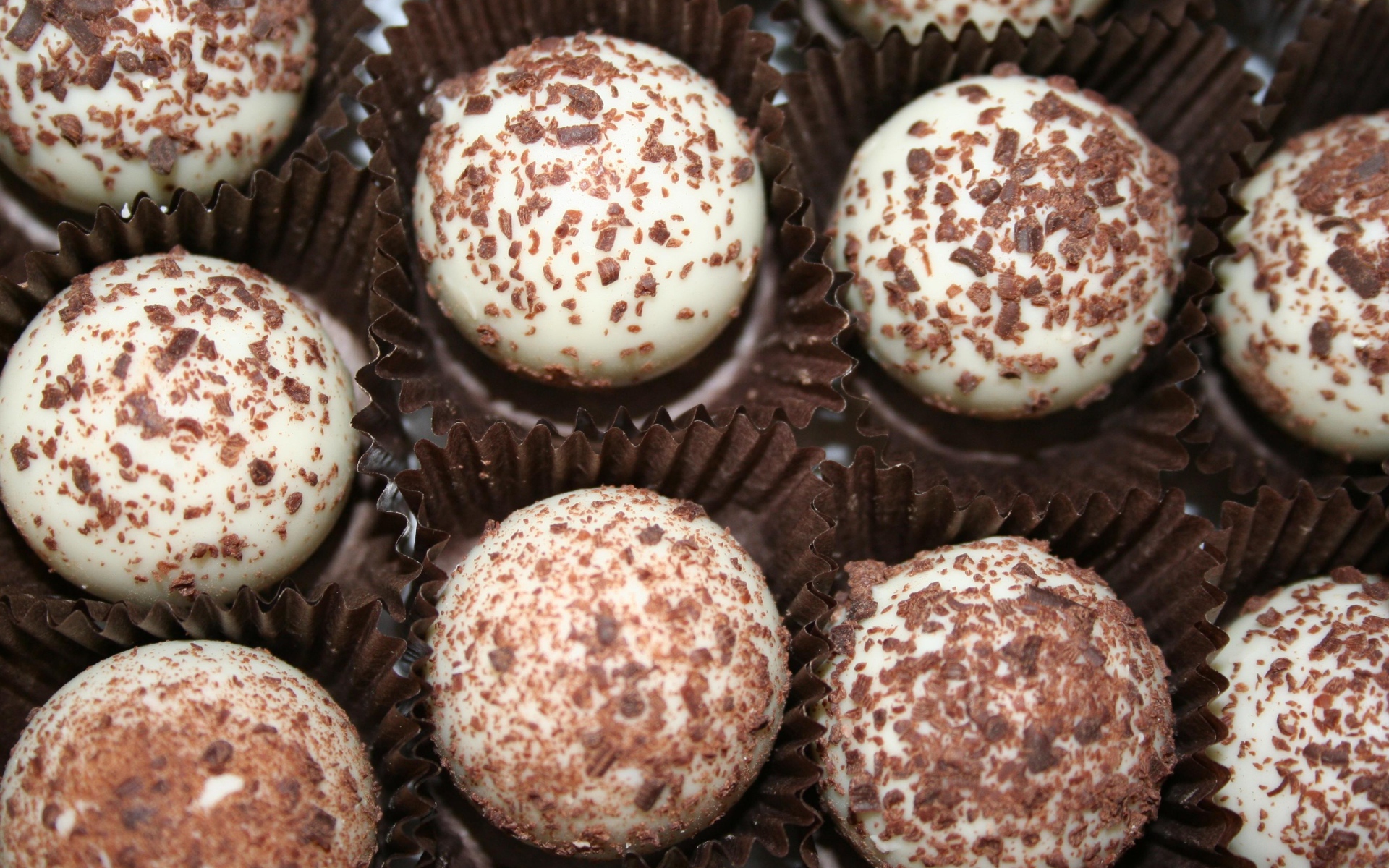 White candies with chocolate sprinkles