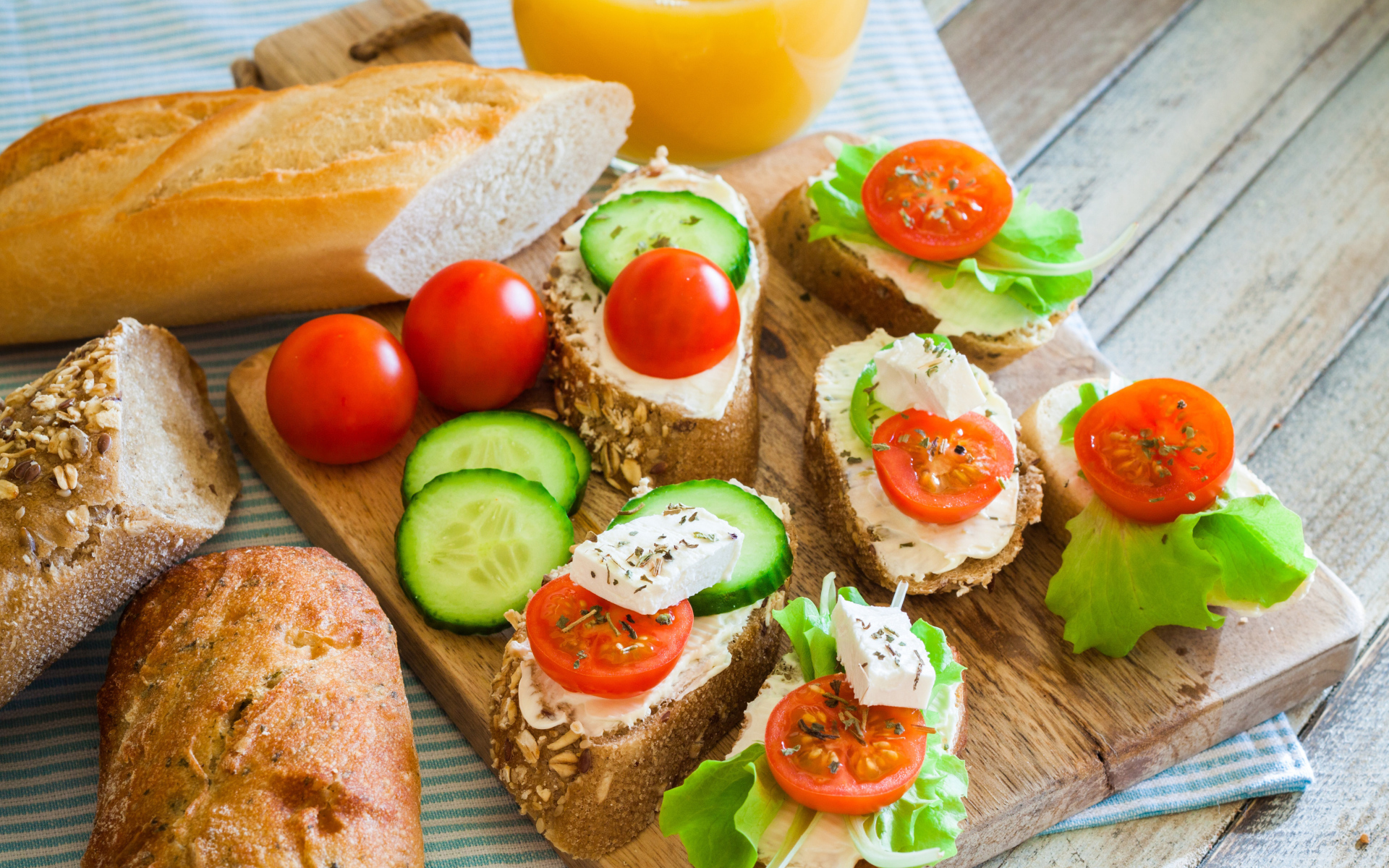 Sandwiches with cheese cucumbers and tomatoes for breakfast