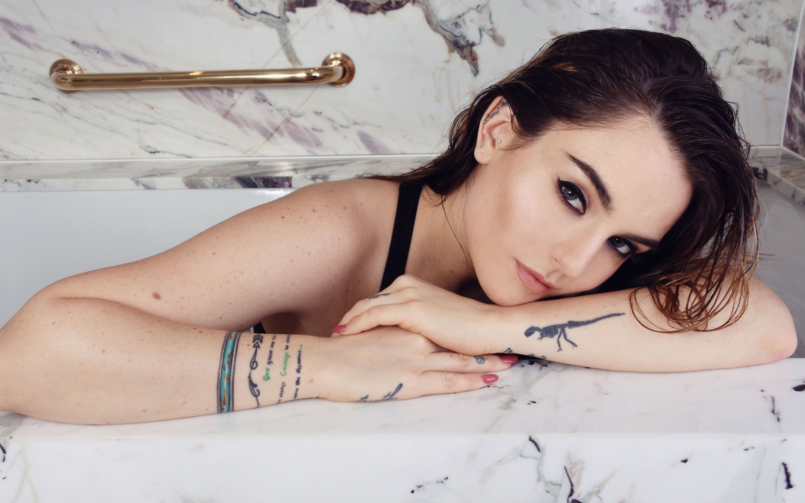 American singer Jojo with tattoos in her arms