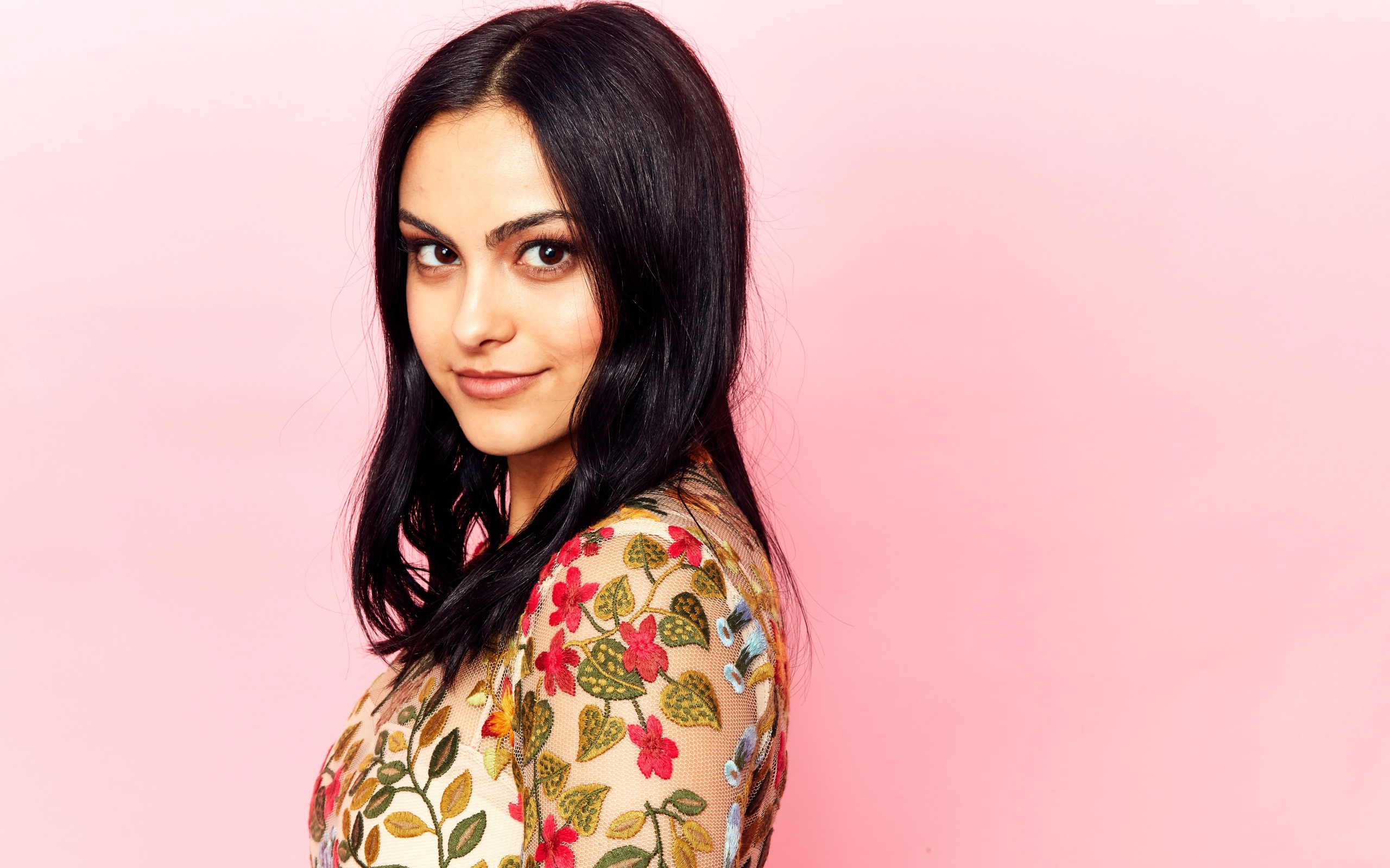 Young actress Camila Mendes photo on a pink background
