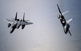 Military aircraft / fighter aircraft over the ocean
