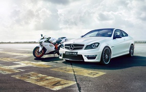 Motorcycle Ducati 848 and Mercedes C63 AMG