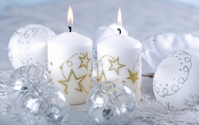 Burning white candles on Christmas