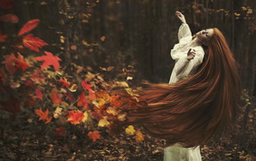 Girl with long hear, autumn leaves