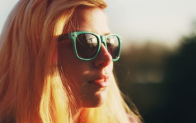 Blonde in green glasses
