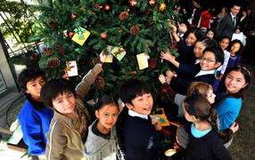 Children near the Christmas tree
