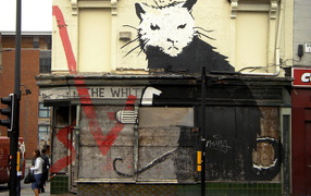 Graffiti on the building, the artist Banksy