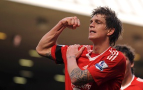 Liverpool Daniel Agger is showing his muscle