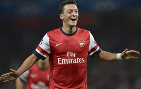 The player of Arsenal Mesut Ozil is happy after victory