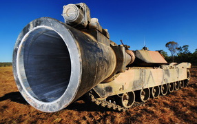 	   The barrel of the gun on the tank