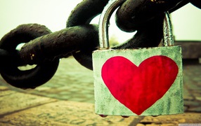 A lock with a heart on a chain