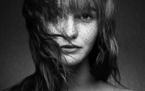 Black and white photo of a girl with freckles